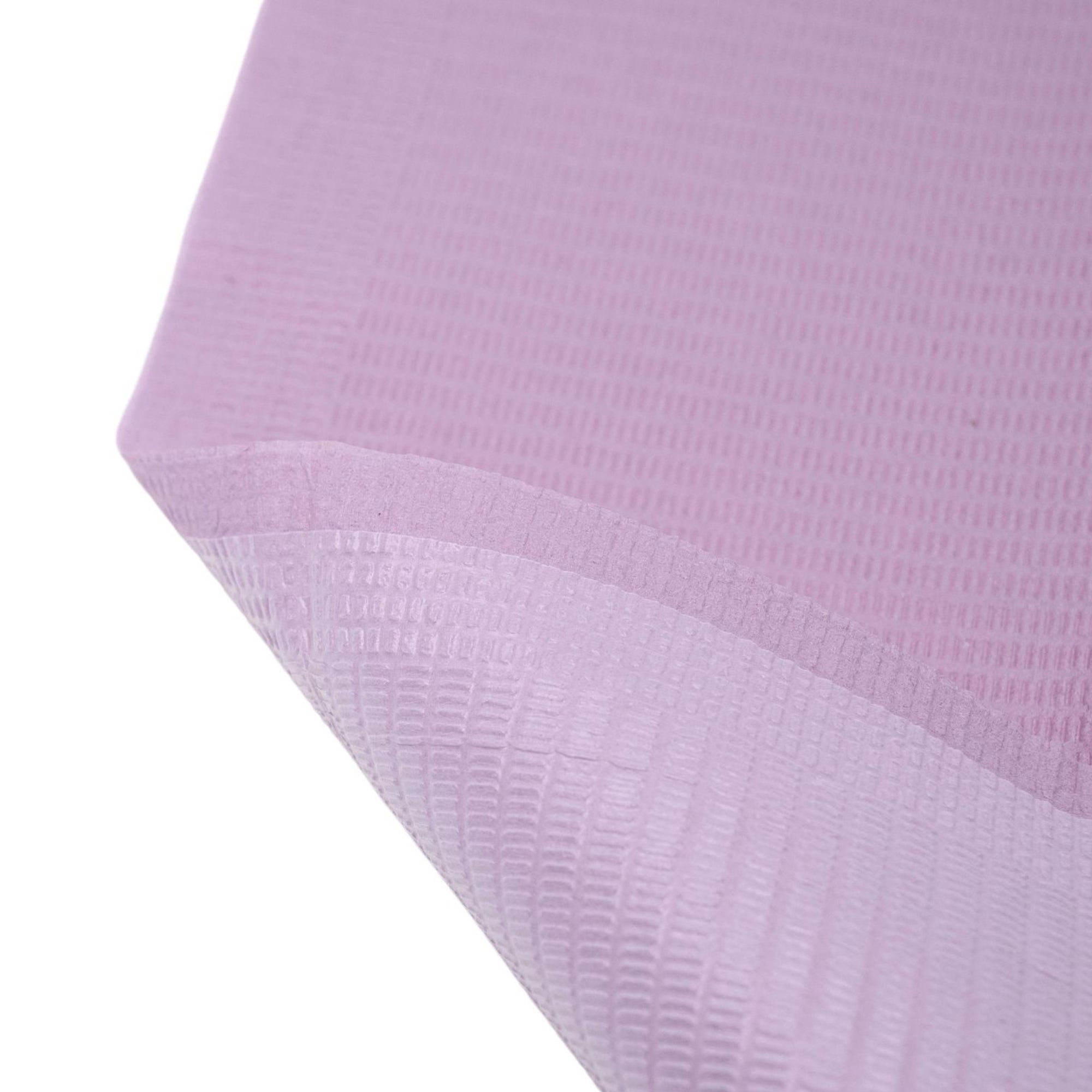 Close-up of dental bib showing waterproof layer