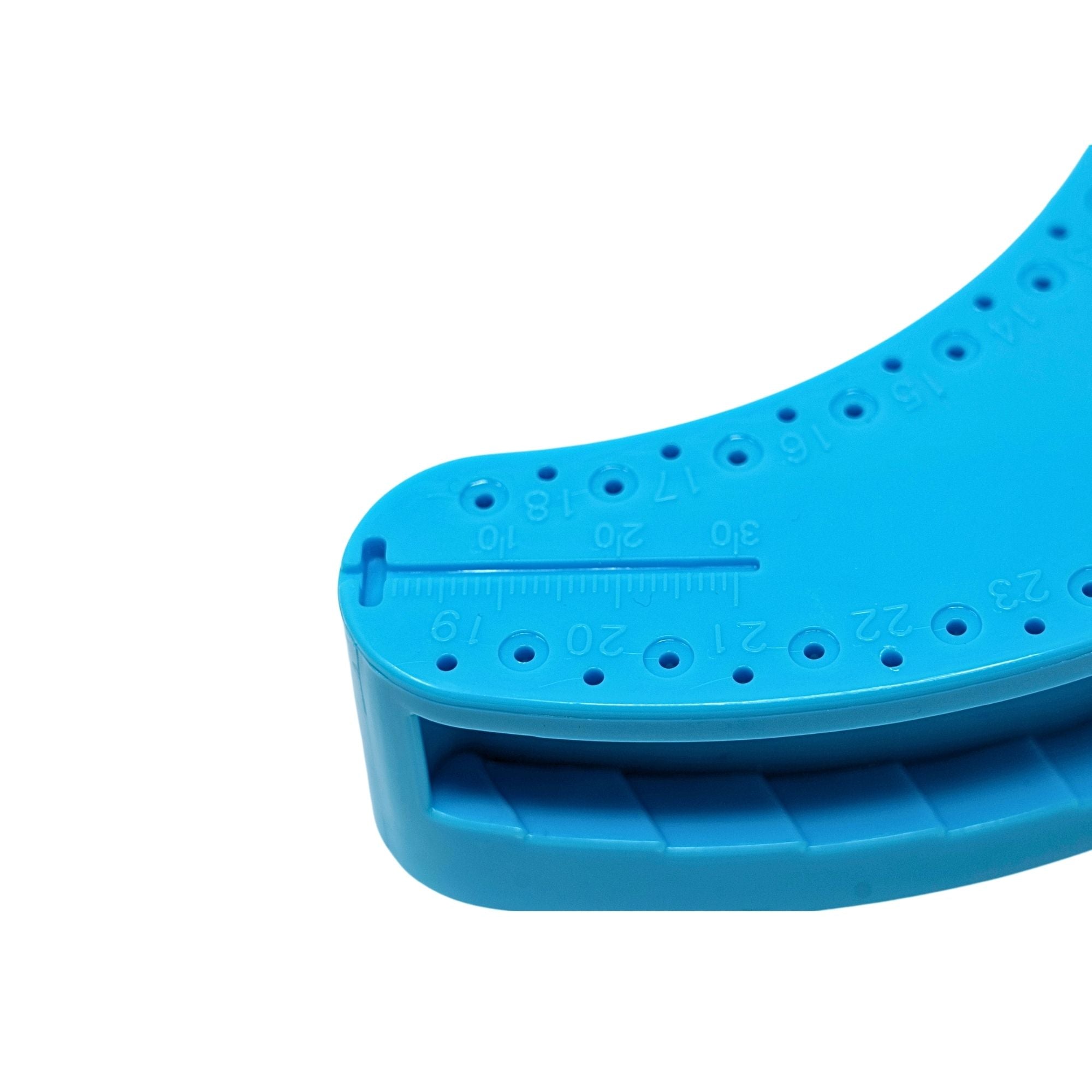 Blue plastic endo ruler with cow horn style design featuring slots and measurement holes for dental k files close up