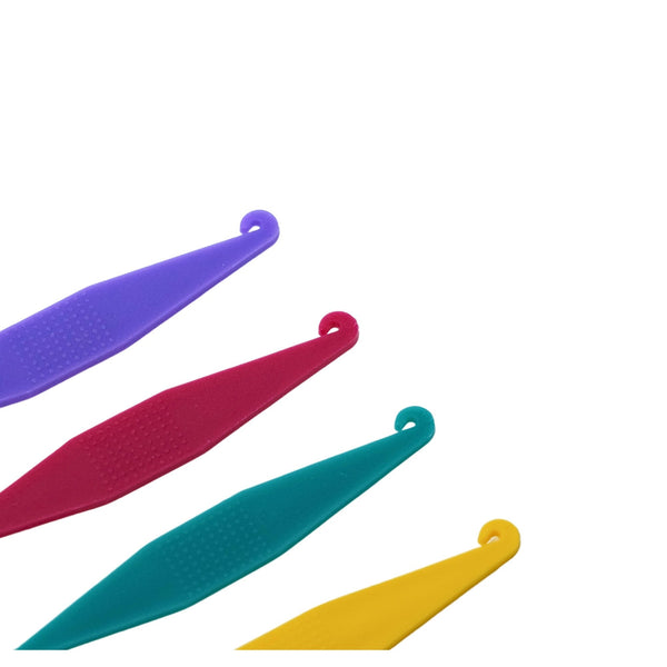 Orthodontic elastic placers with textured grip multi-colored close up